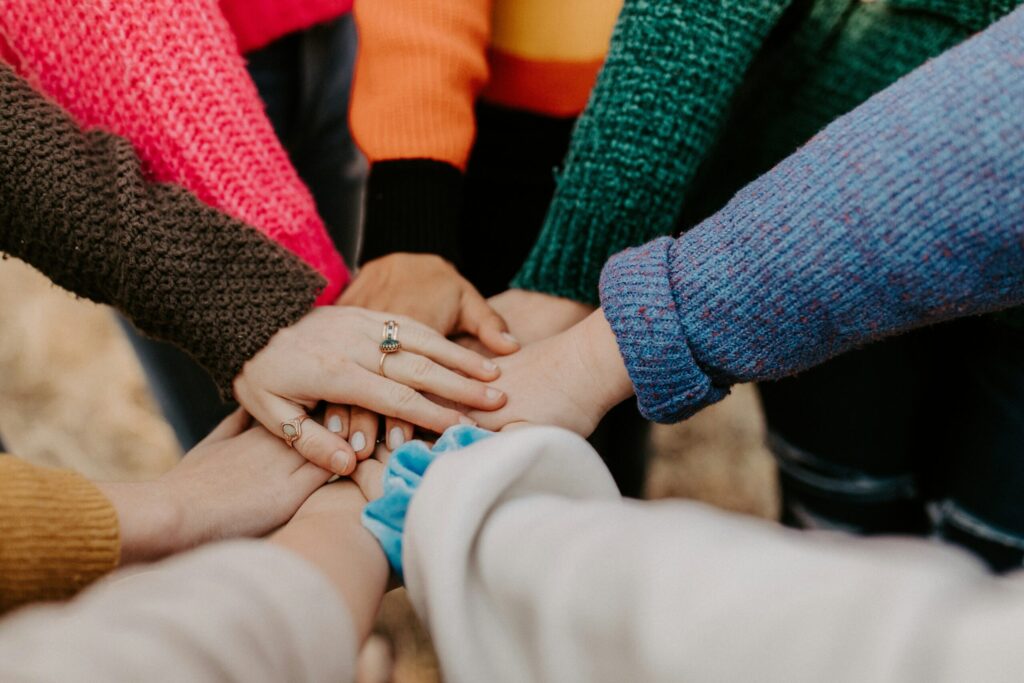Hands put together as gesture of teamwork